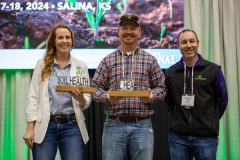 Carolyn Wingate, the 2024 Regenerative Woman of the Year and Marcus Richardson, the 2024 Young Producer of the Year at Soil Health U, accepted their awards Jan. 17 in Salina, Kansas from High Plains Journal Publisher Zac Stuckey. (Journal photo by Kylene Scott.)
